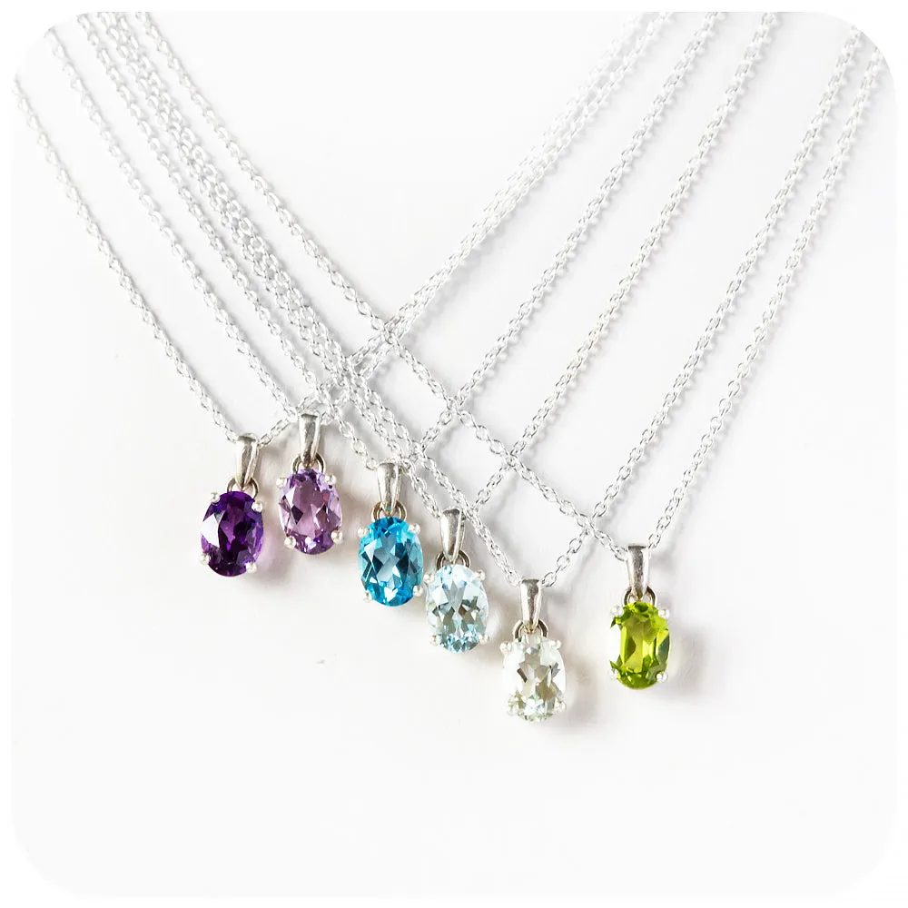 Luna, an Oval cut Peridot Necklace - 7x5mm